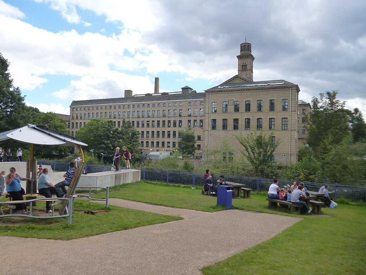 Salts Mill’s Victorian stone buildings overlooking gardens in Saltaire